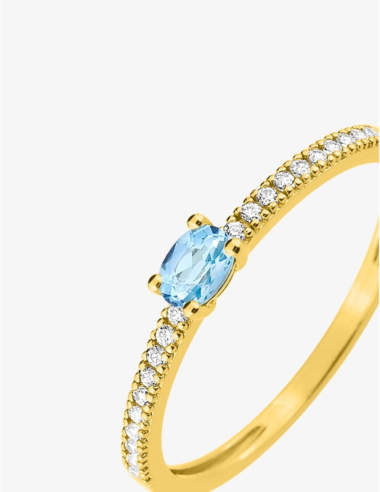 Bague en or jaune 375‰, topaze éclatante et oxydes