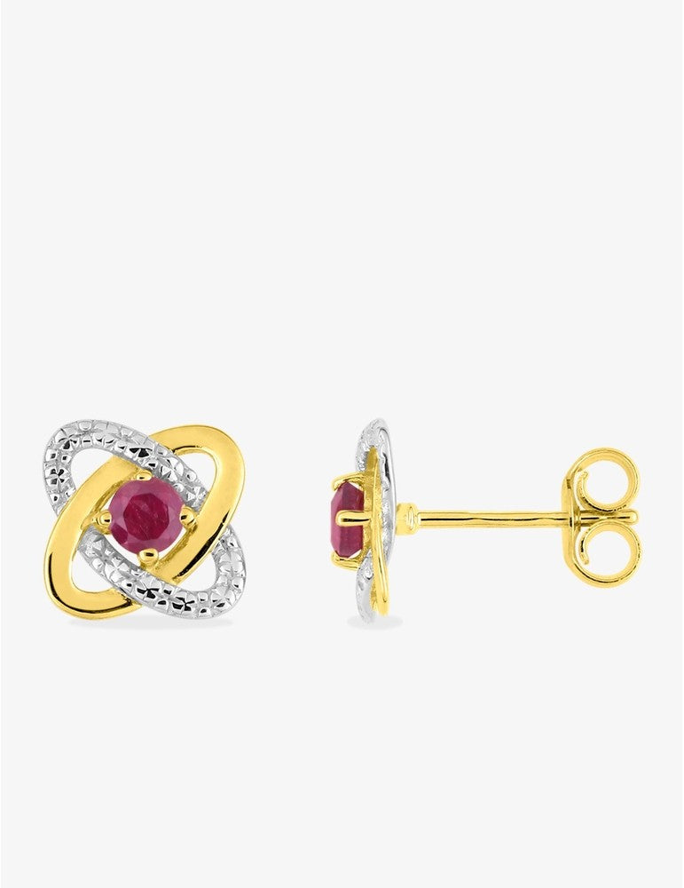 Boucles d'oreilles clous or jaune 375 ‰ rhodium et rubis serti griffes
