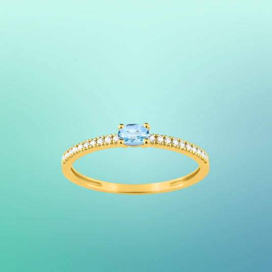 Bague en or jaune 375‰, topaze éclatante et oxydes